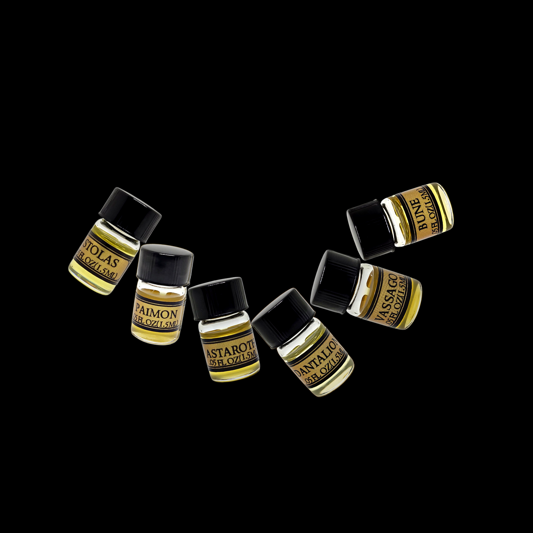 Six oil sample bottles for the Goetia Collection on a dark background, leaning against each other to create a swirl,